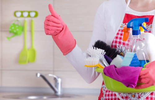 Cleaner using protective equipment during carpet cleaning